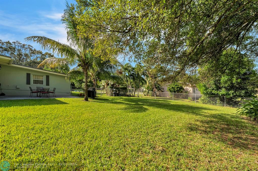 5751 Pine Terrace Plantation, FL 33317 - Photo 33 of 35 a view of swimming pool with an outdoor space and seating area