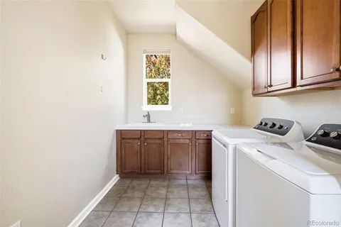 a bedroom with a bed table and window