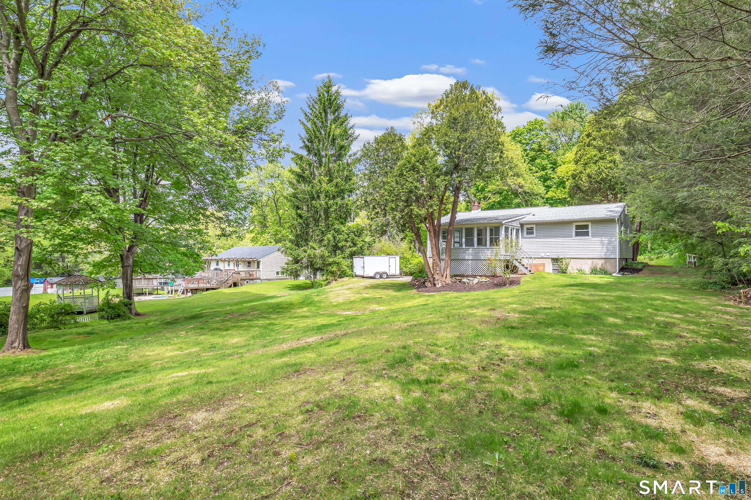 7 Longview Road Newtown, CT 06482 - Photo 38 of 40 a view of a house with a garden