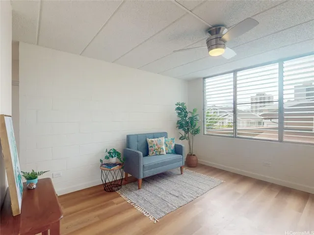 a living room with furniture and a window