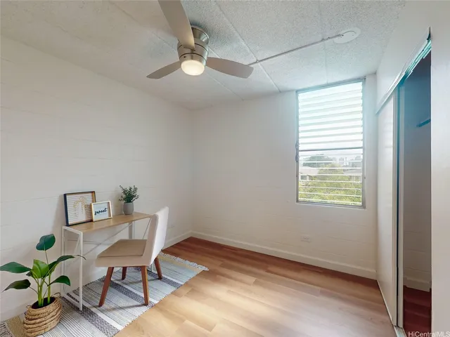 a workspace with furniture and window