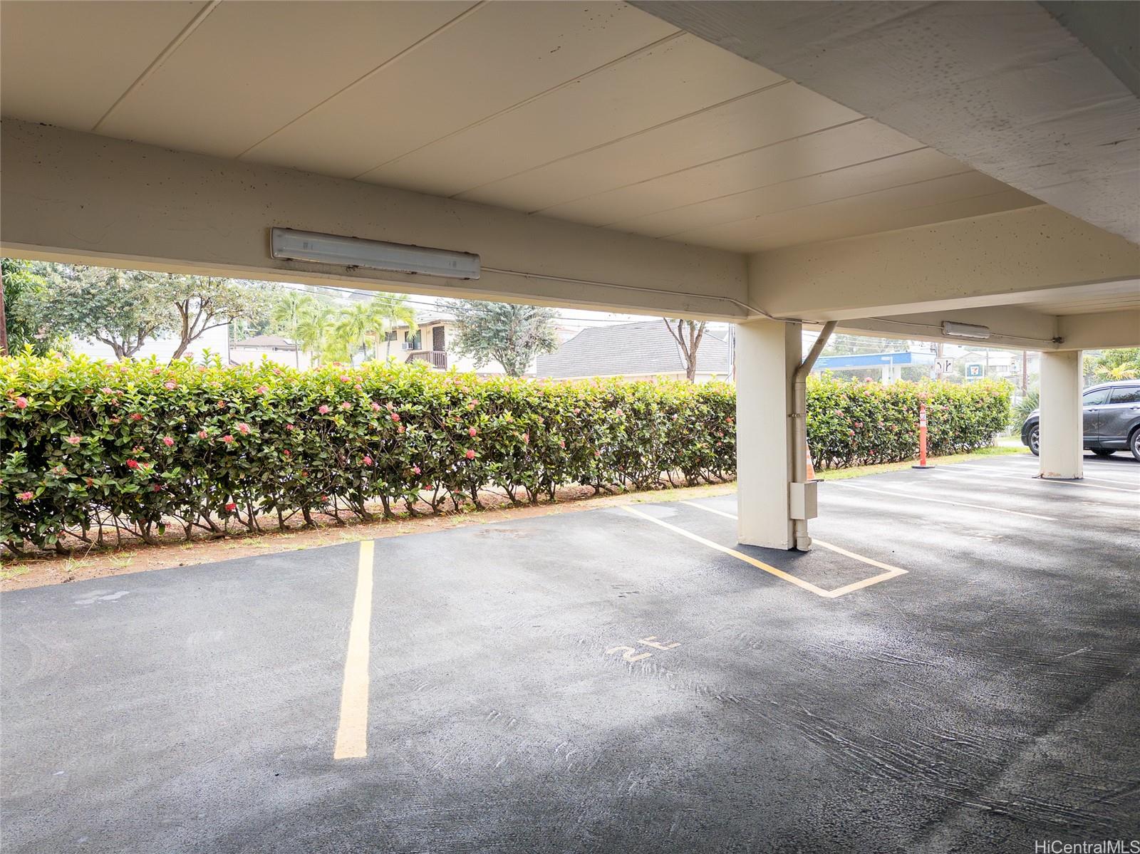 2015 Wilder Avenue, Unit 2E Honolulu, HI 96822 - Photo 10 of 12 a view of a room with wooden floor