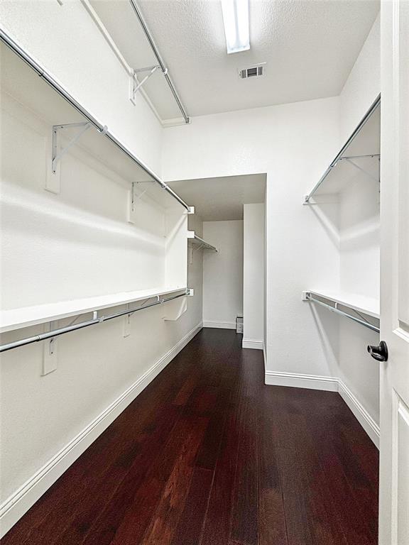 3037 Crestwater Ridge Keller, TX 76248 - Photo 16 of 25 a view of a room with wooden floor and white walls