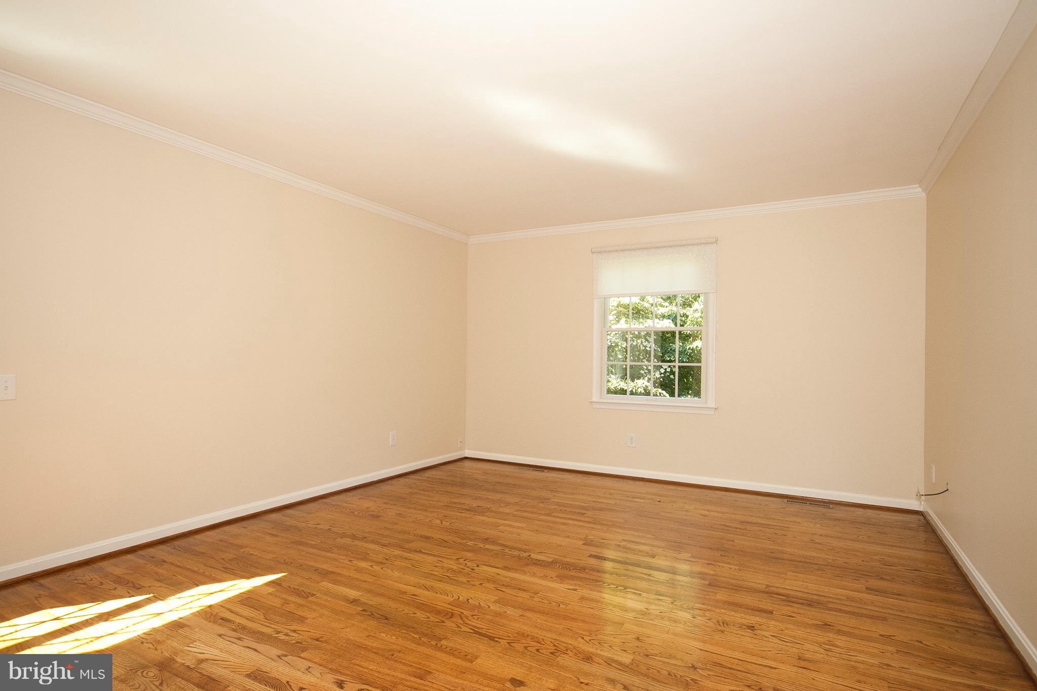 1907 Ridge Road Reisterstown, MD 21136 - Photo 11 of 27 an empty room with wooden floor and windows