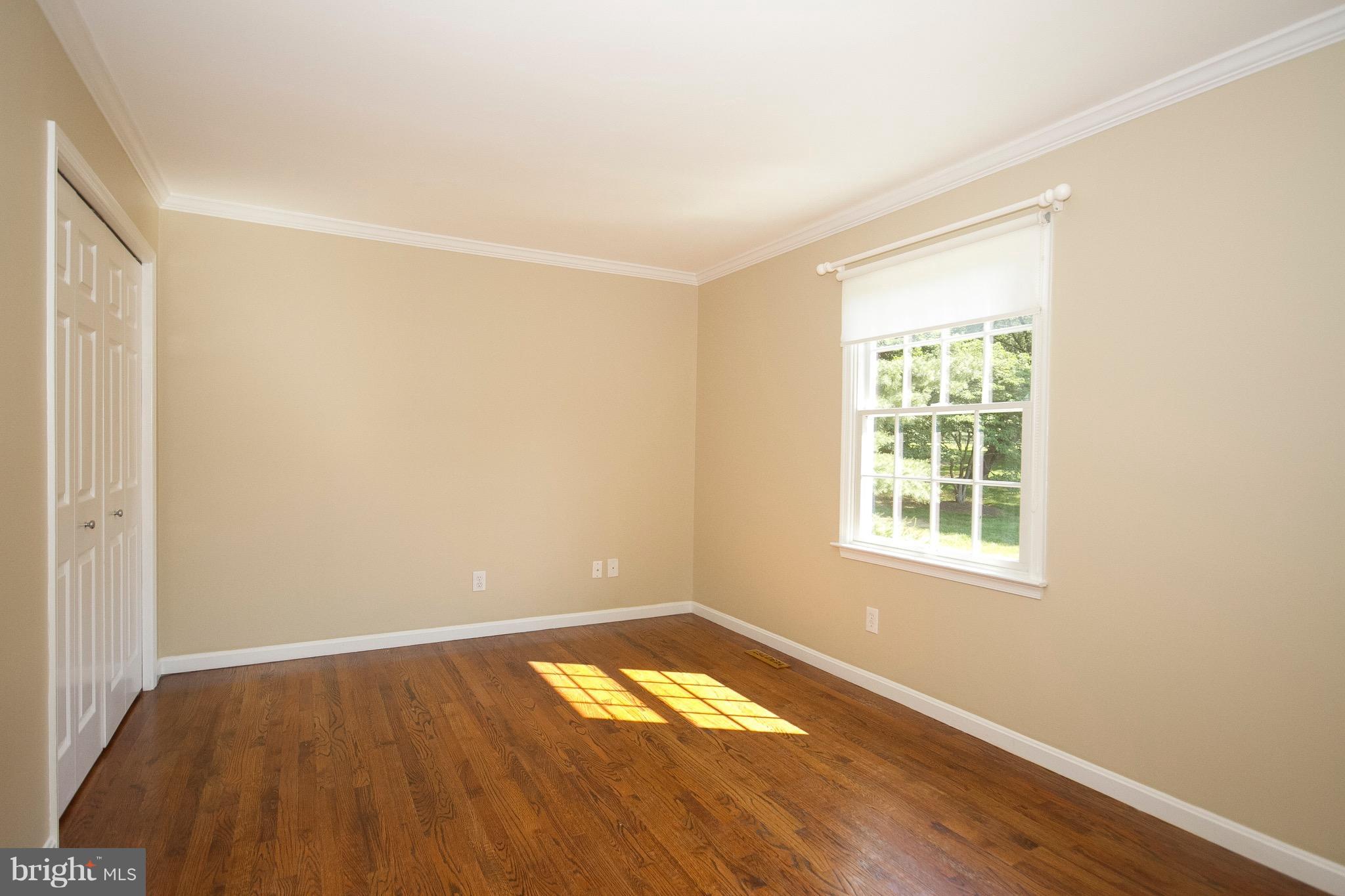 1907 Ridge Road Reisterstown, MD 21136 - Photo 13 of 27 an empty room with wooden floor and windows