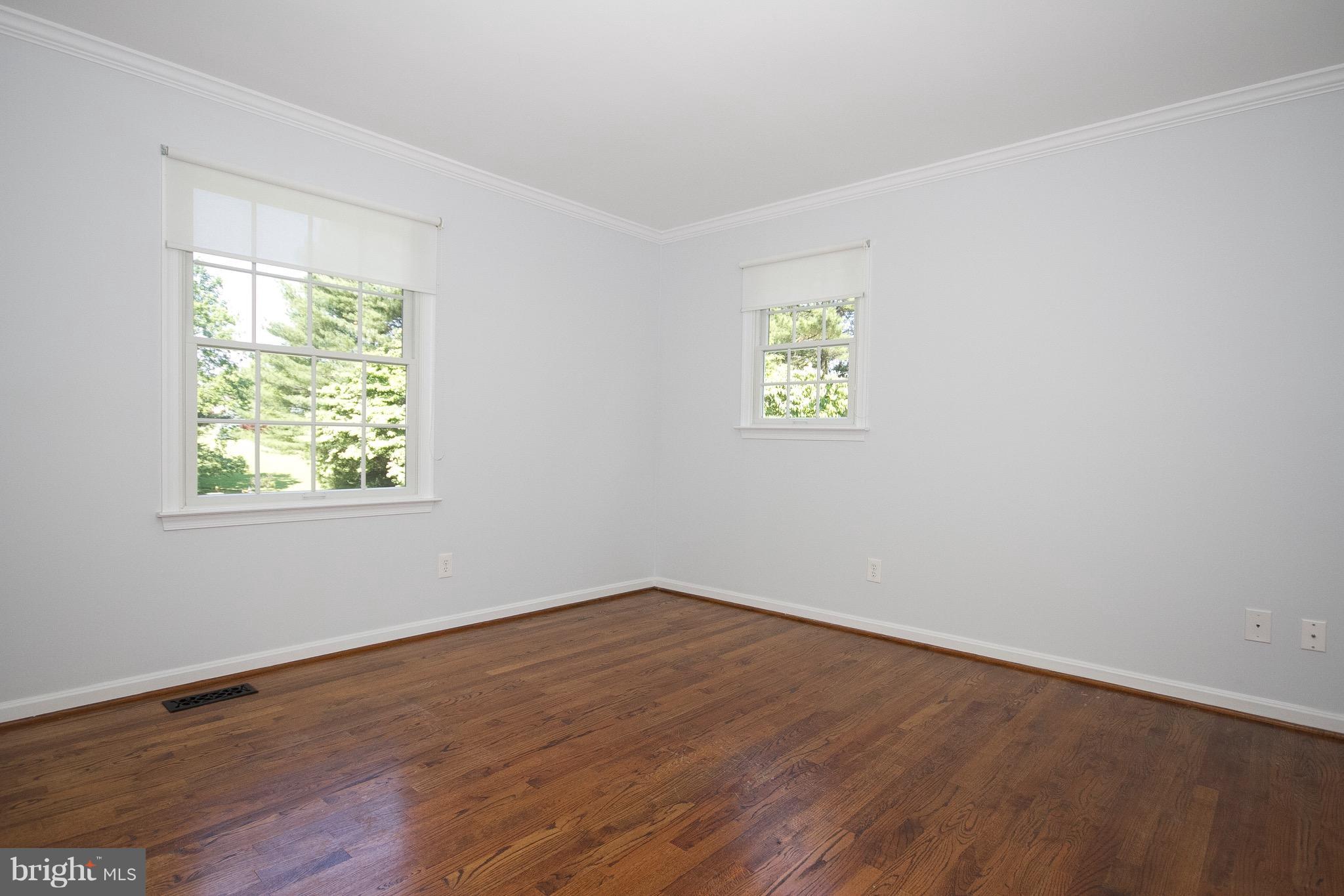1907 Ridge Road Reisterstown, MD 21136 - Photo 16 of 27 wooden floor in an empty room with a window