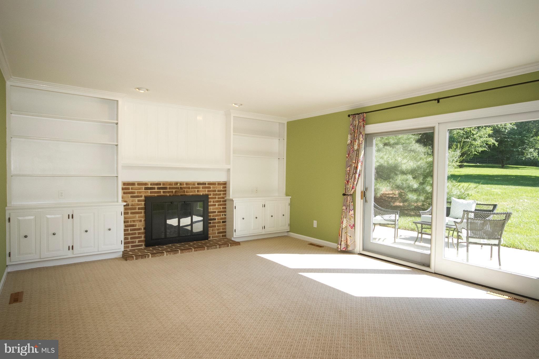 1907 Ridge Road Reisterstown, MD 21136 - Photo 26 of 27 a view of an empty room with a fireplace and a window