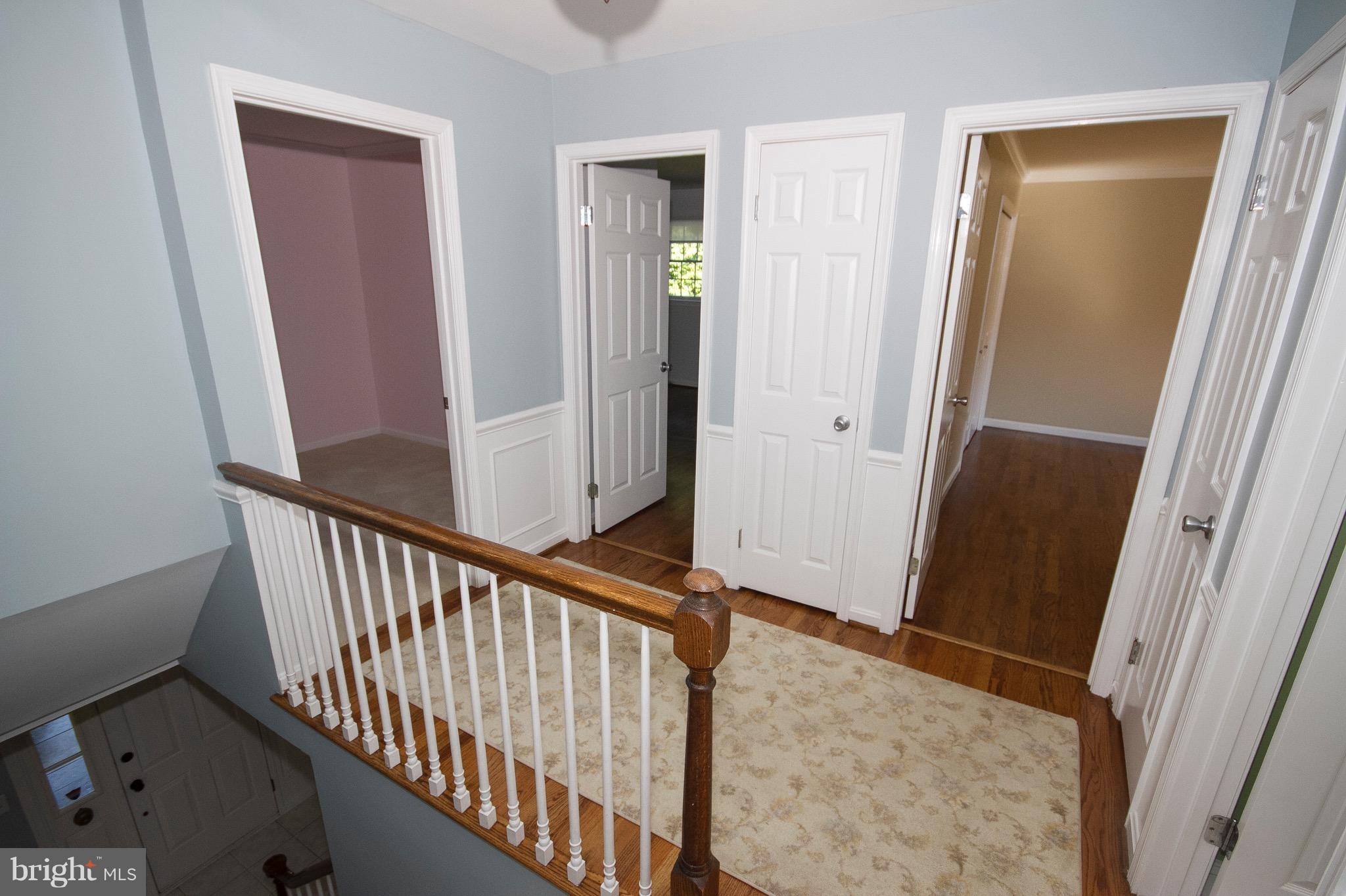 1907 Ridge Road Reisterstown, MD 21136 - Photo 5 of 27 a view of a hallway with wooden floor and staircase