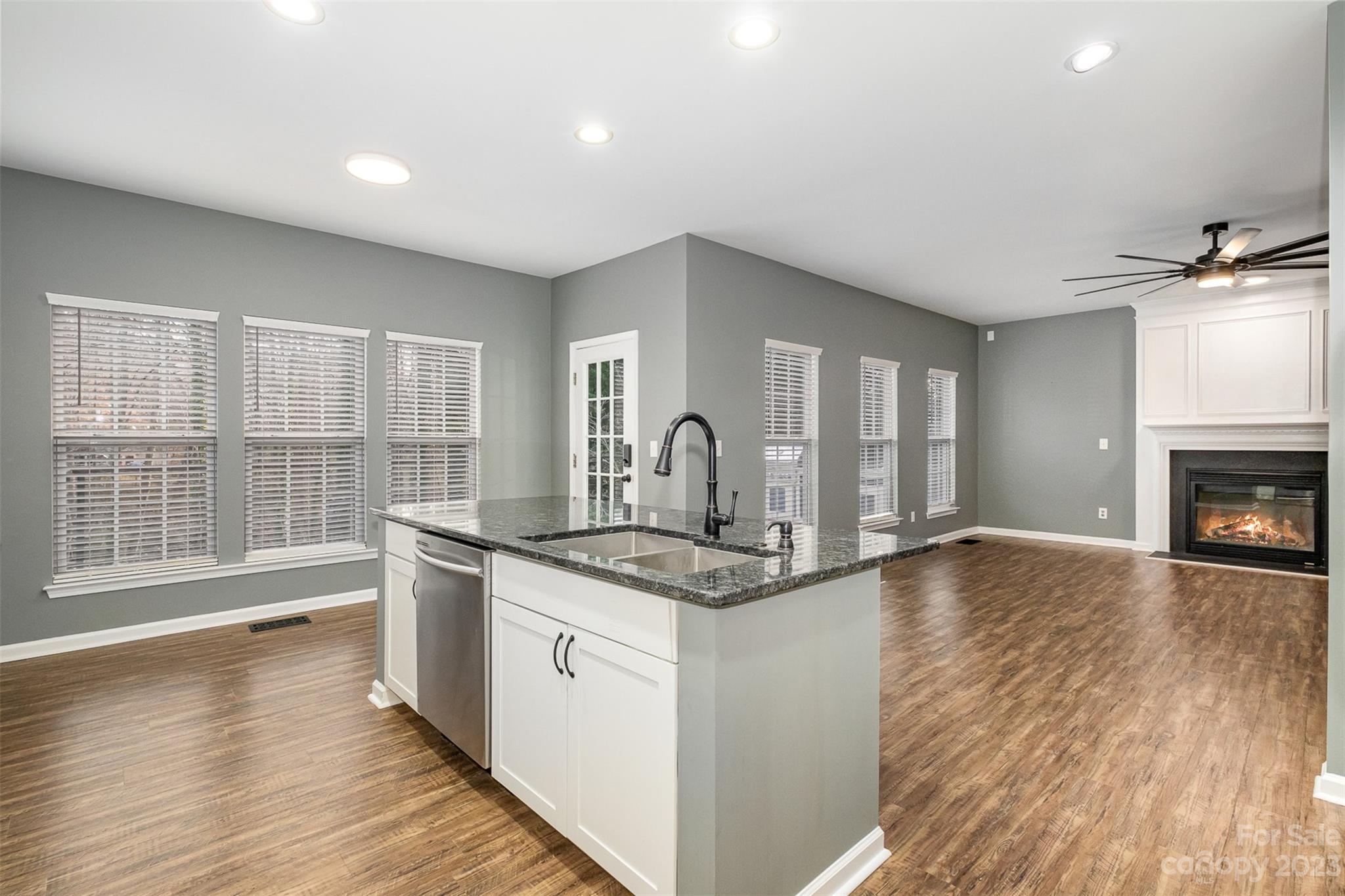 765 Knightswood Road Fort Mill, SC 29708 - Photo 17 of 41 a kitchen with stainless steel appliances granite countertop a stove a sink and a large window