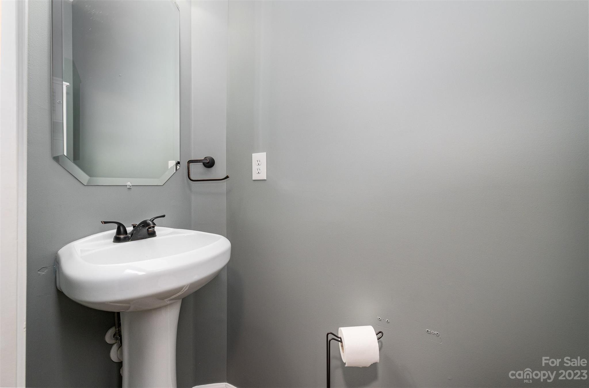765 Knightswood Road Fort Mill, SC 29708 - Photo 19 of 41 a bathroom with a sink and mirror