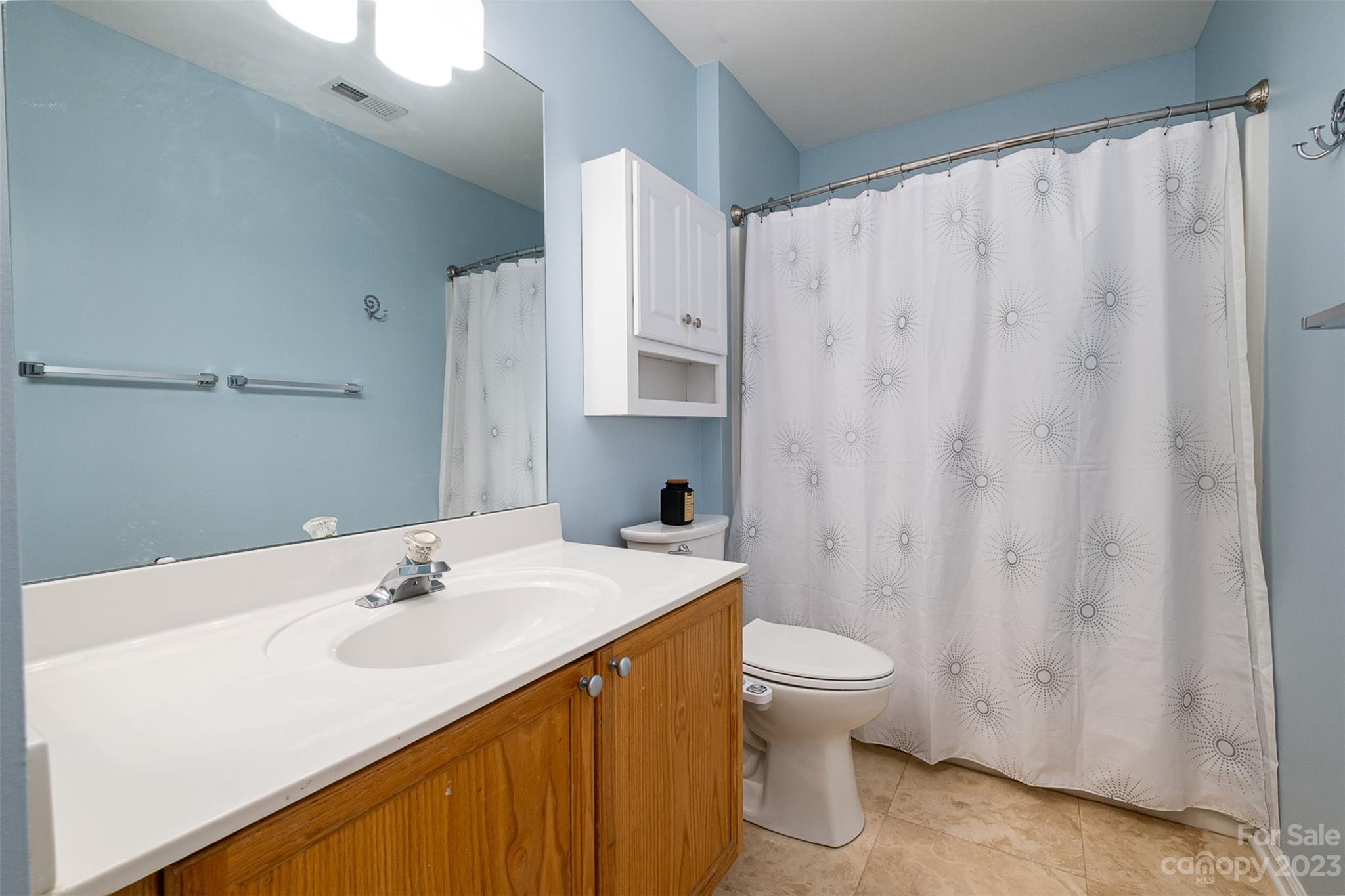 765 Knightswood Road Fort Mill, SC 29708 - Photo 26 of 41 a bathroom with a sink a toilet and a mirror