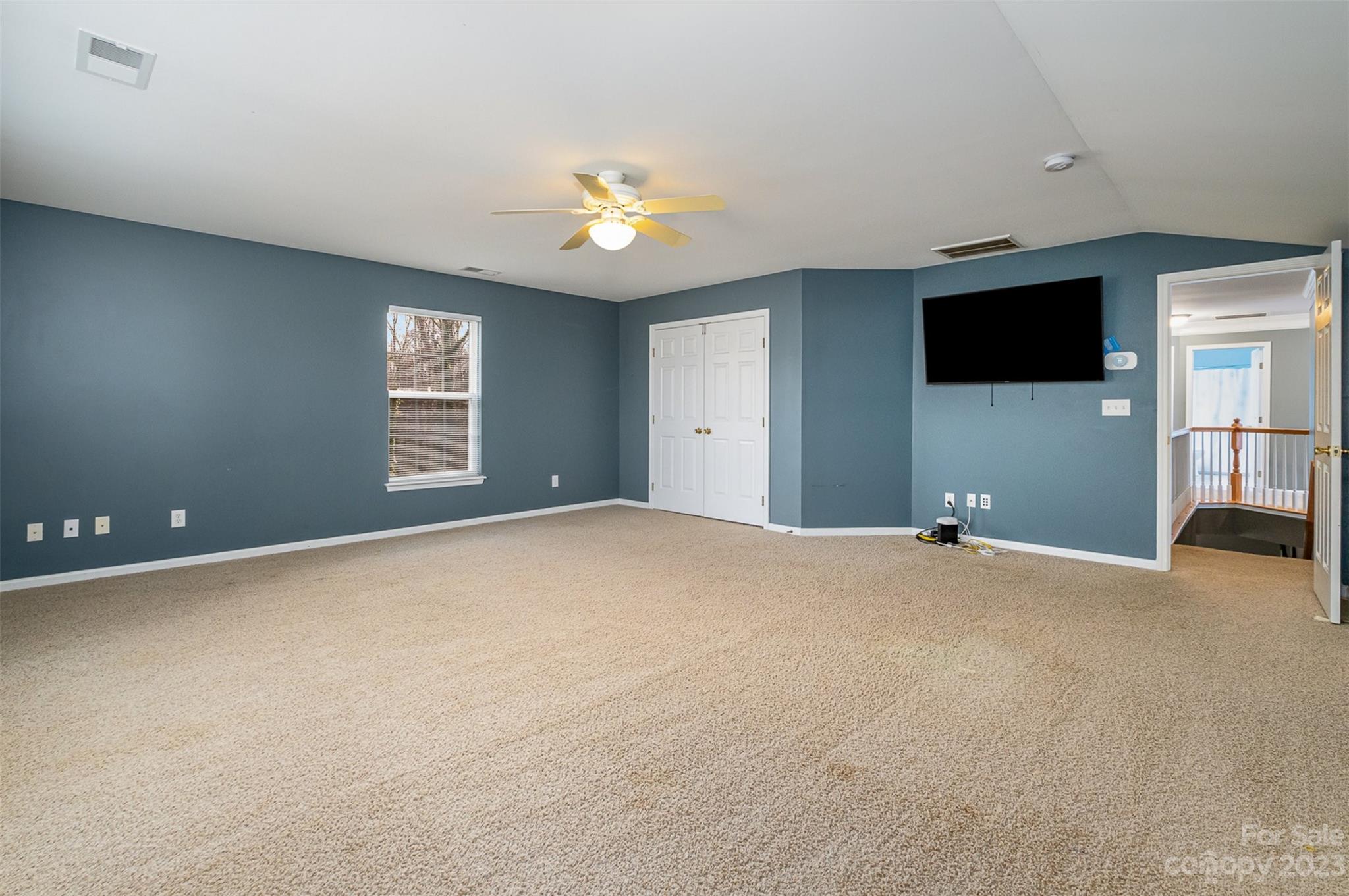 765 Knightswood Road Fort Mill, SC 29708 - Photo 28 of 41 a view of an empty room with a window and a kitchen