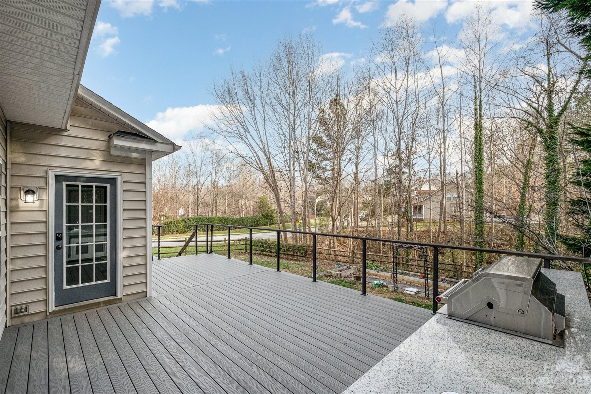 765 Knightswood Road Fort Mill, SC 29708 - Photo 29 of 41 a view of a house with a wooden deck