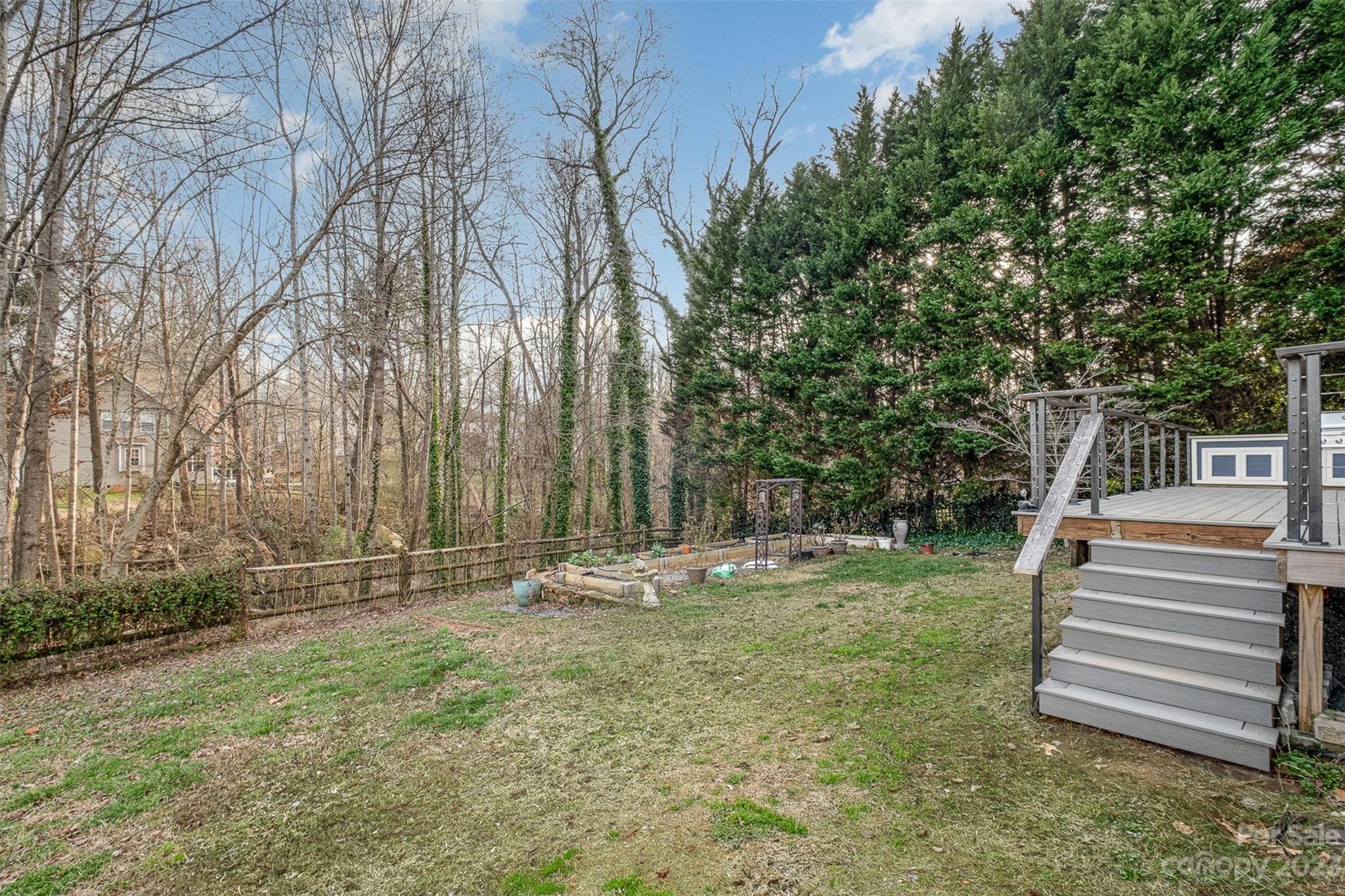 765 Knightswood Road Fort Mill, SC 29708 - Photo 33 of 41 a backyard of a house with lots of green space and chair