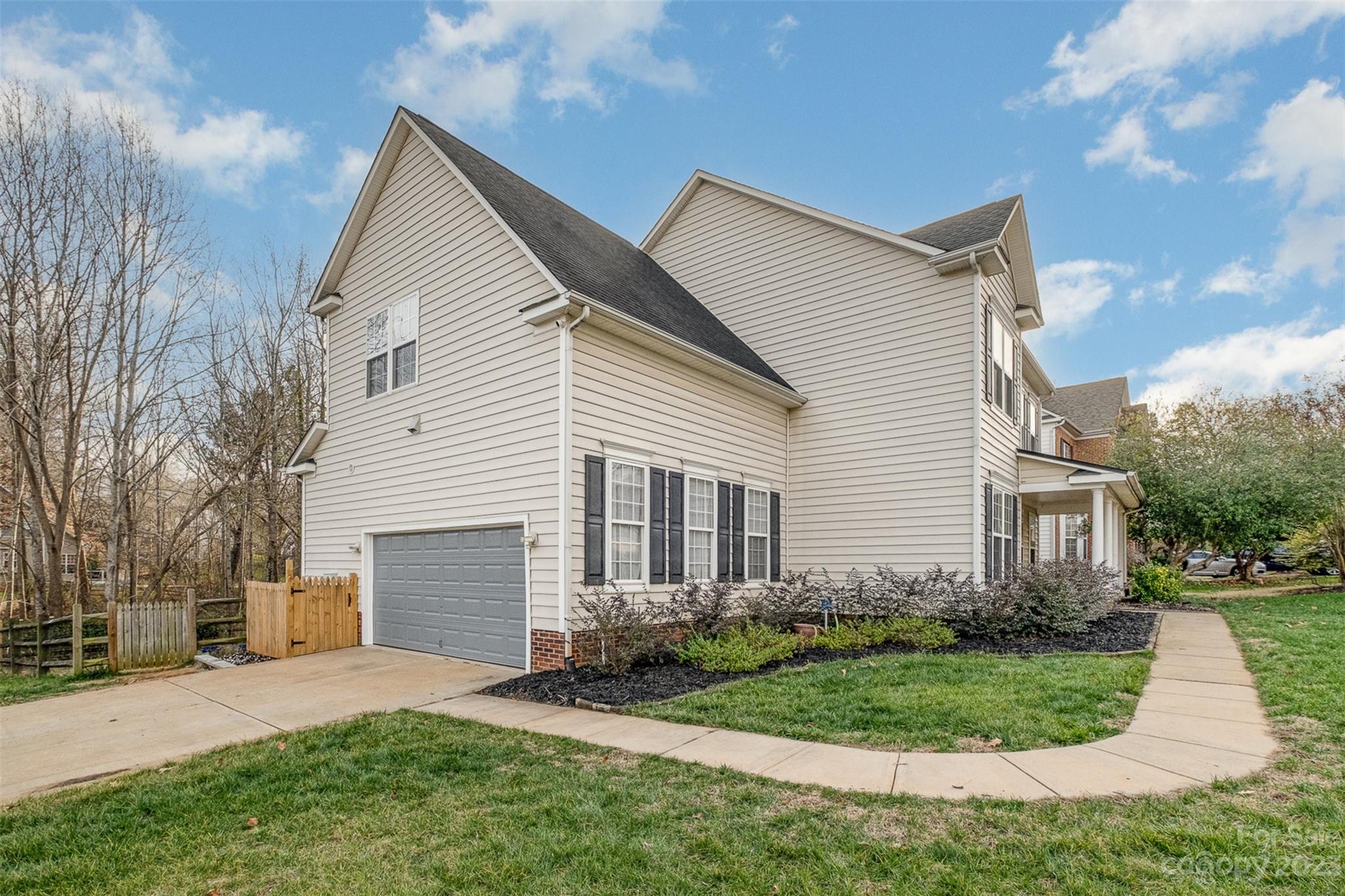 765 Knightswood Road Fort Mill, SC 29708 - Photo 34 of 41 a front view of a house with a garden and yard