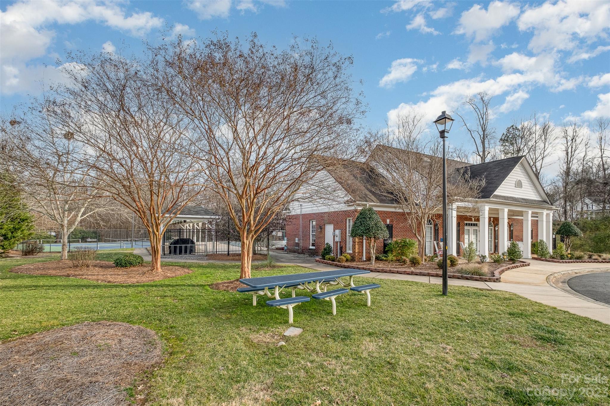 765 Knightswood Road Fort Mill, SC 29708 - Photo 38 of 41 a backyard of a house with garden and outdoor seating