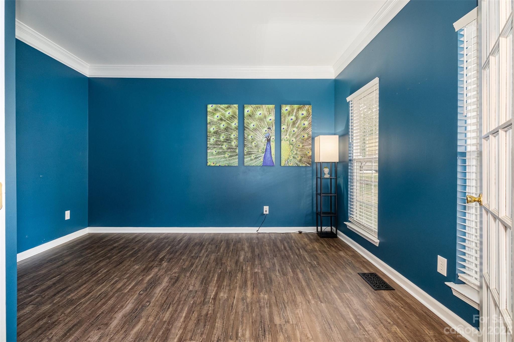 765 Knightswood Road Fort Mill, SC 29708 - Photo 7 of 41 a view of empty room with wooden floor and fan