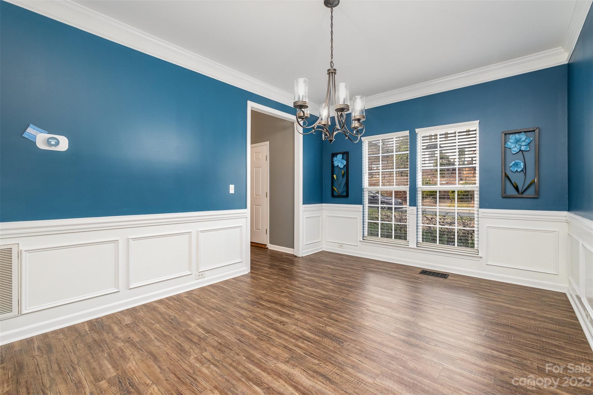 765 Knightswood Road Fort Mill, SC 29708 - Photo 8 of 41 a view of an empty room with wooden floor and a window