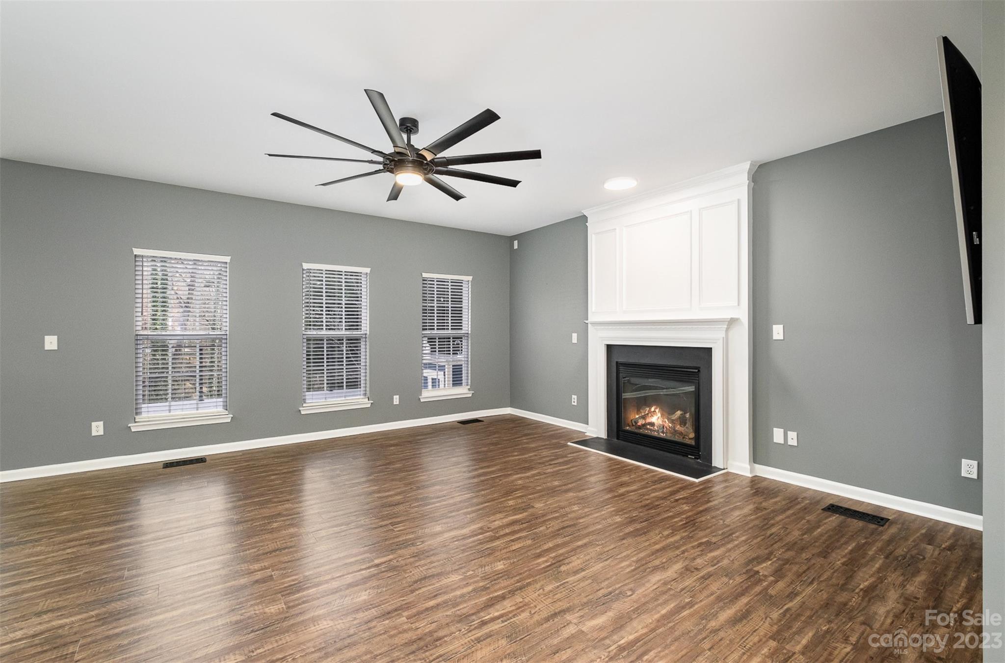 765 Knightswood Road Fort Mill, SC 29708 - Photo 10 of 41 a view of an empty room with window and wooden floor