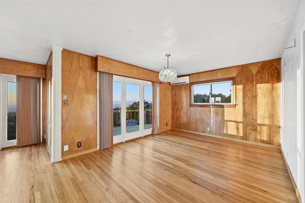 a kitchen with stainless steel appliances granite countertop a sink a stove and a wooden floors