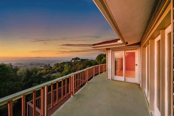 an aerial view of house with yard and mountain view in back