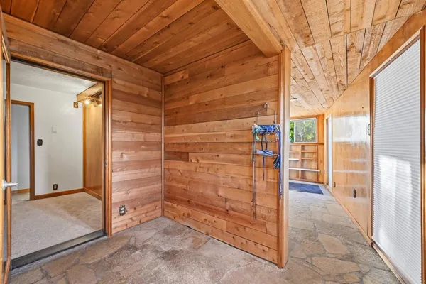 a view of walk in closet with clothes