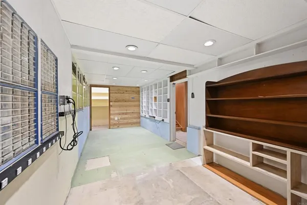 a view of balcony with wooden floor and fence