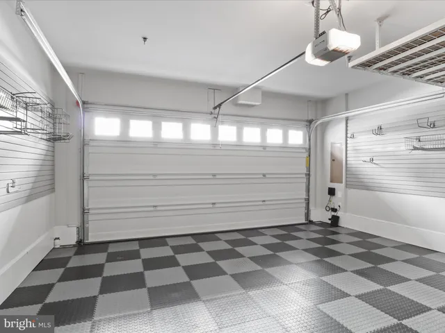 a view of staircase with lots of frames and a rug