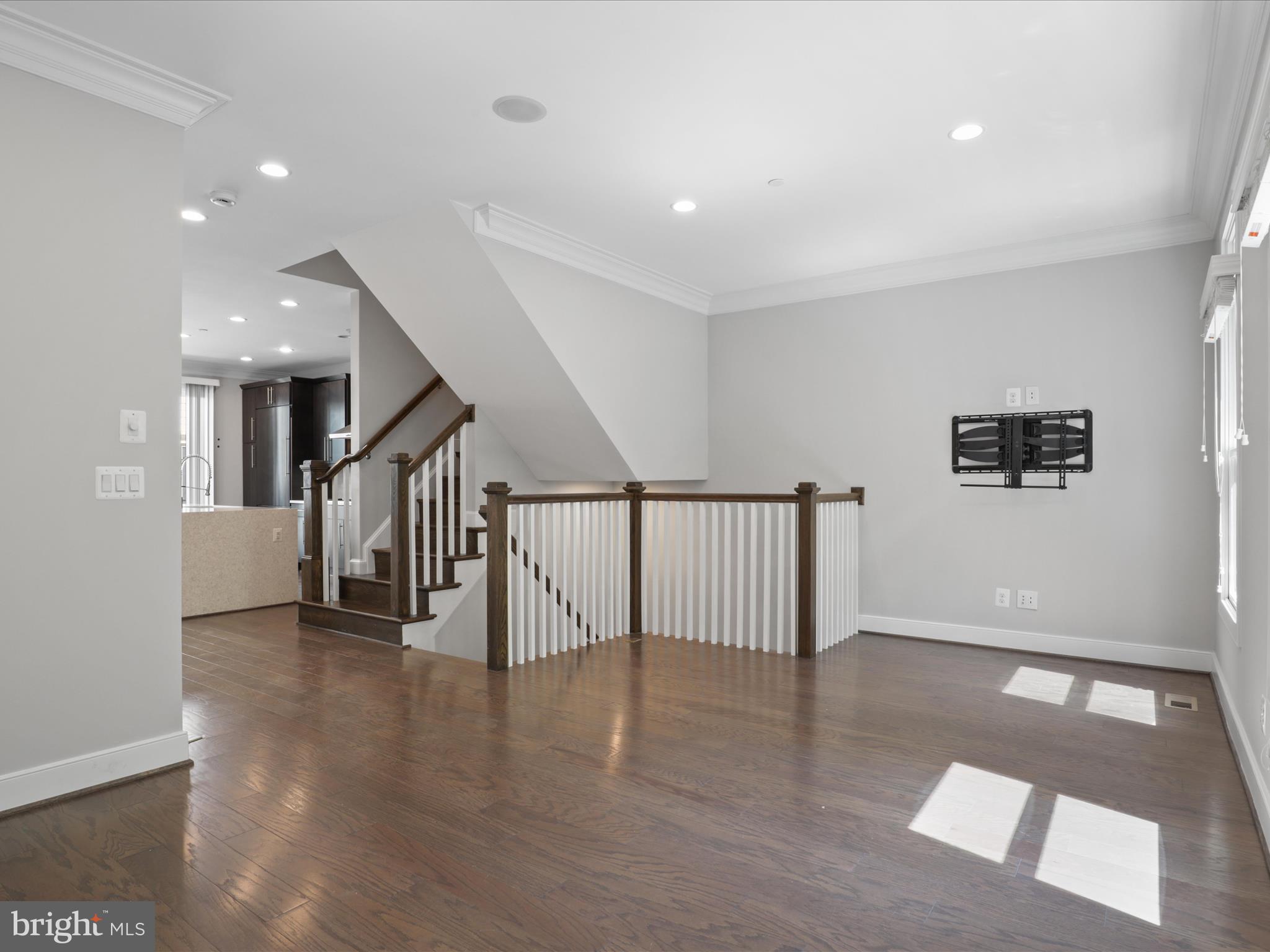 1521 16th Road North Arlington, VA 22209 - Photo 15 of 59 a view of staircase with lots of frames and a rug