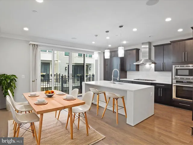 a kitchen with a sink stove and refrigerator