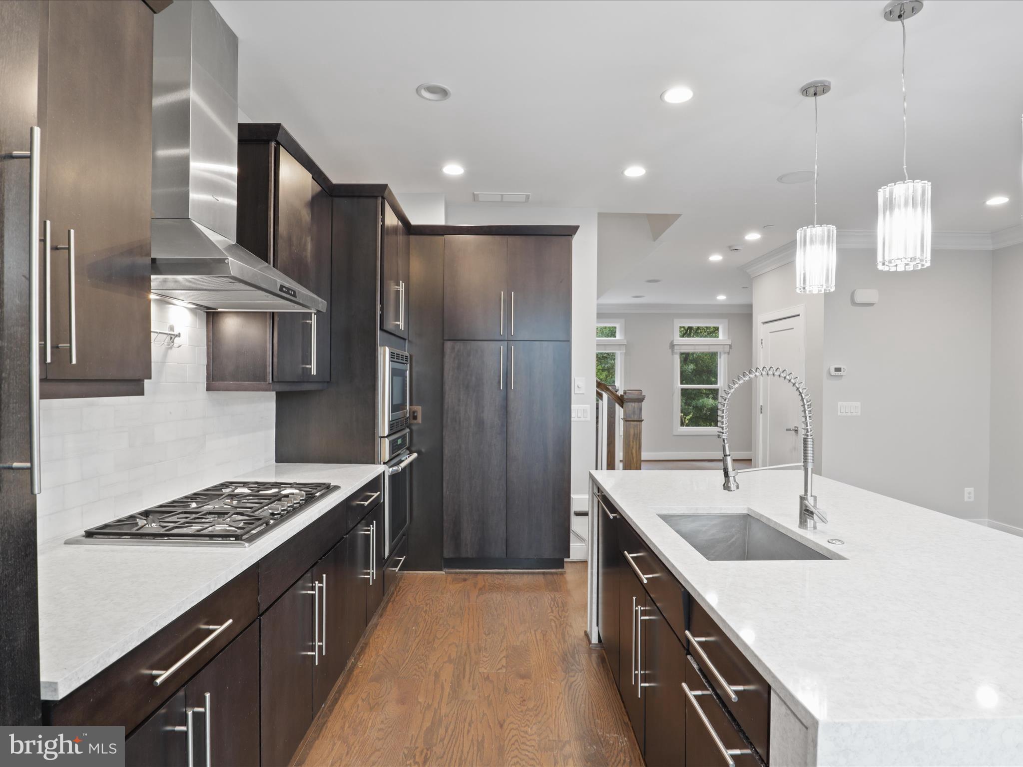 1521 16th Road North Arlington, VA 22209 - Photo 21 of 59 a kitchen with a sink stove and refrigerator