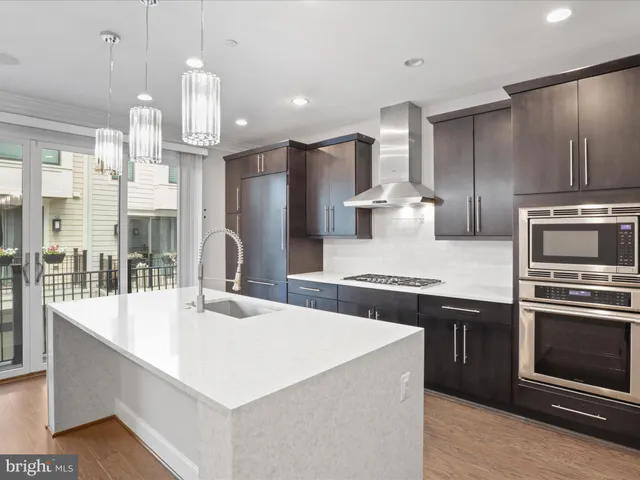 a bedroom with a large bed and flat tv screen