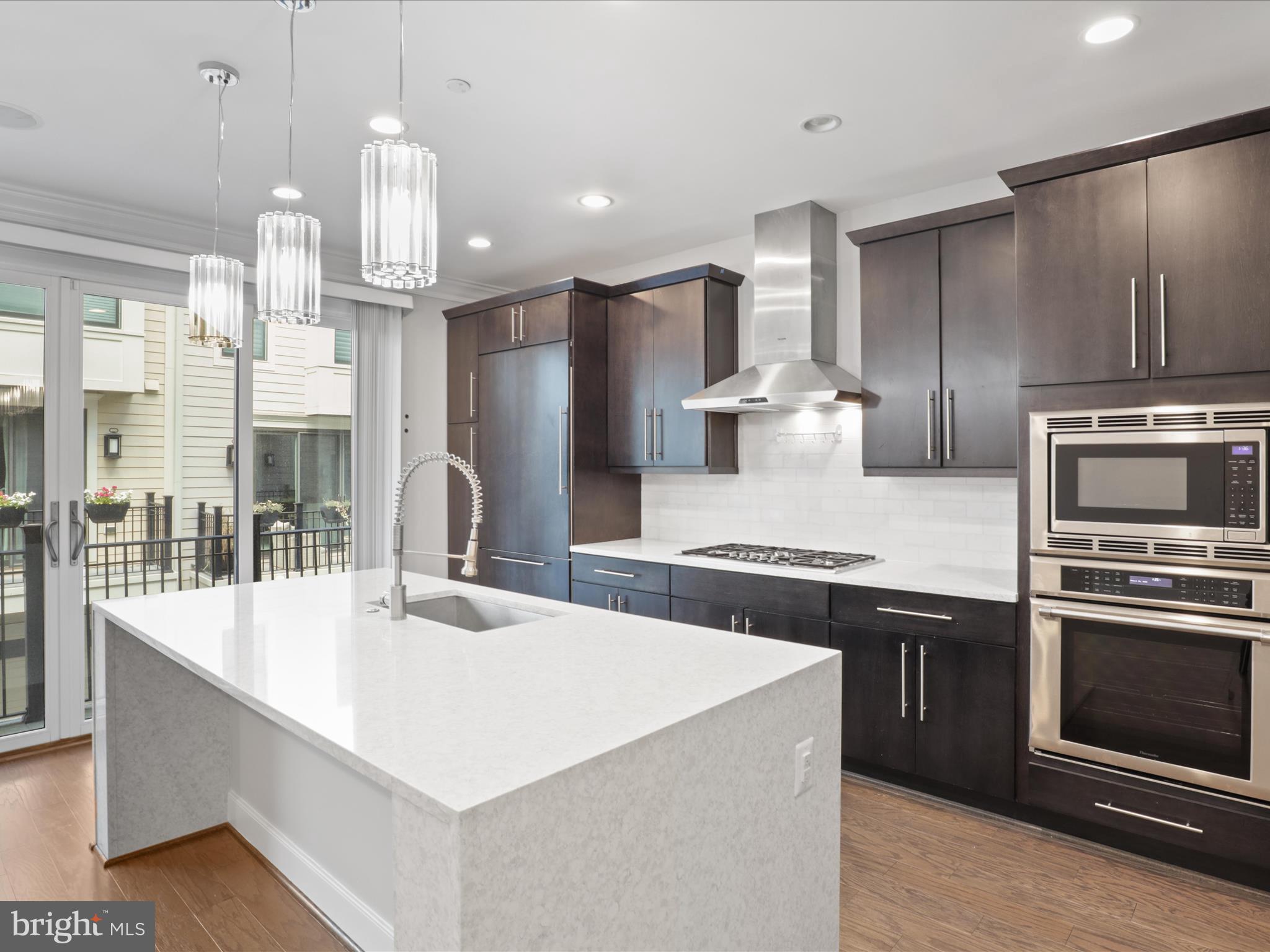 1521 16th Road North Arlington, VA 22209 - Photo 22 of 59 a kitchen with stainless steel appliances kitchen island granite countertop a stove a sink a refrigerator and a refrigerator
