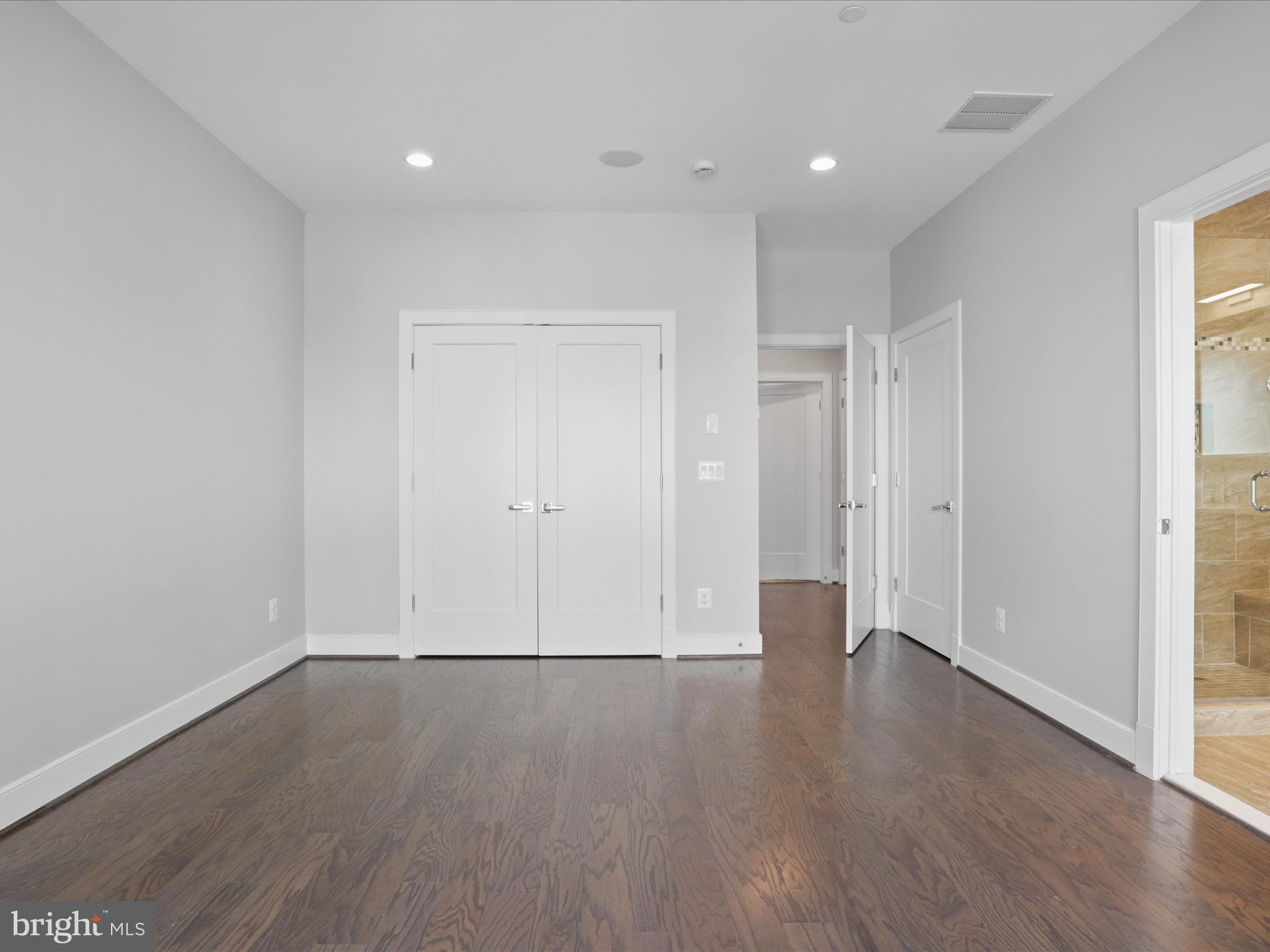 1521 16th Road North Arlington, VA 22209 - Photo 24 of 59 a view of an empty room with wooden floor