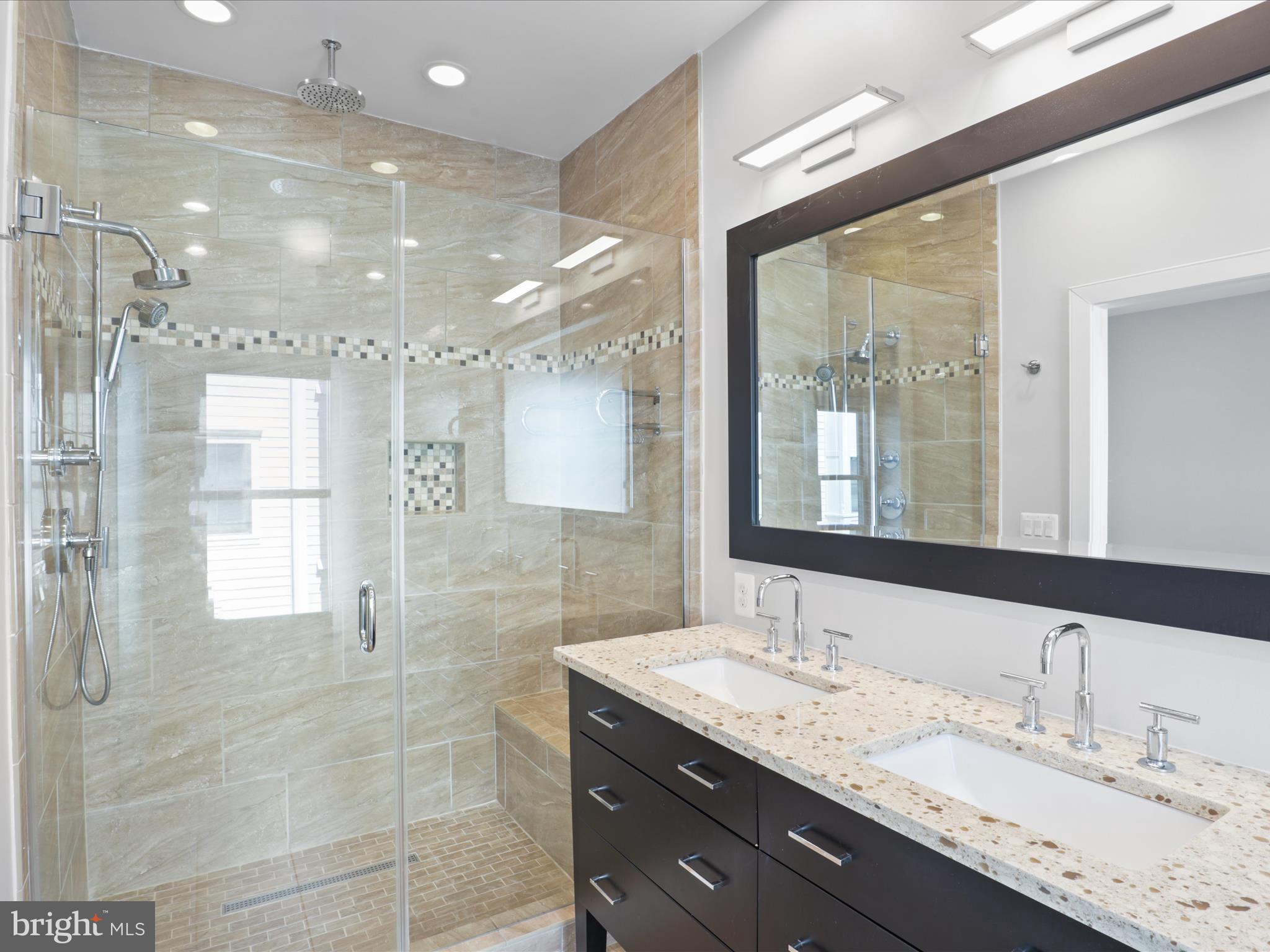 1521 16th Road North Arlington, VA 22209 - Photo 27 of 59 a bathroom with a granite countertop sink mirror and shower