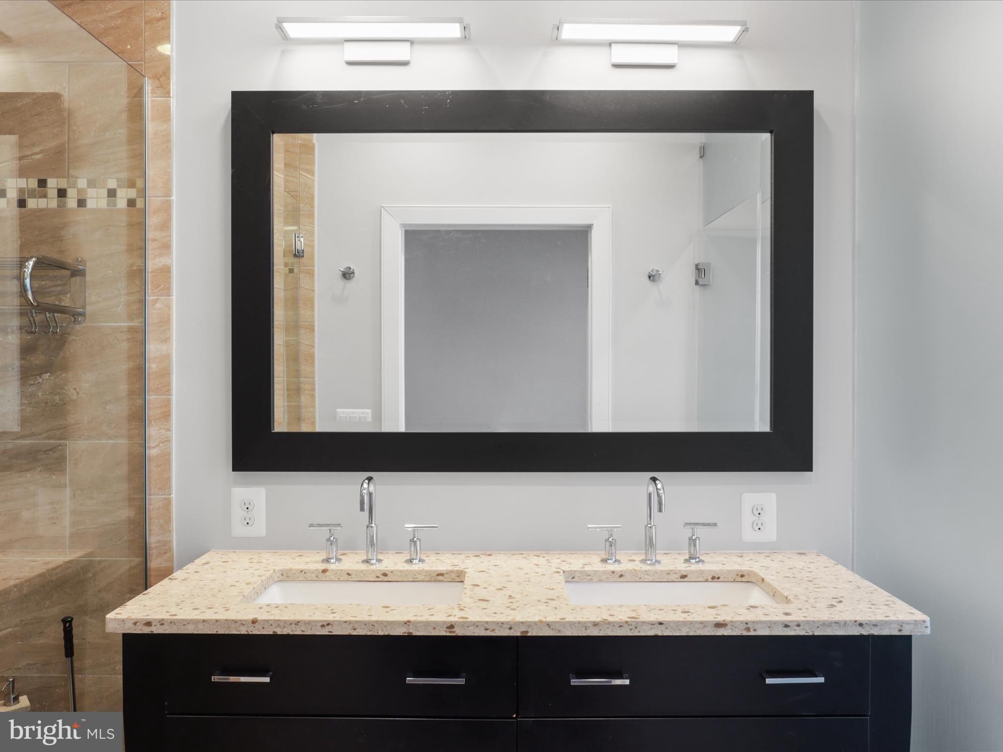 1521 16th Road North Arlington, VA 22209 - Photo 28 of 59 a bathroom with a sink and a mirror