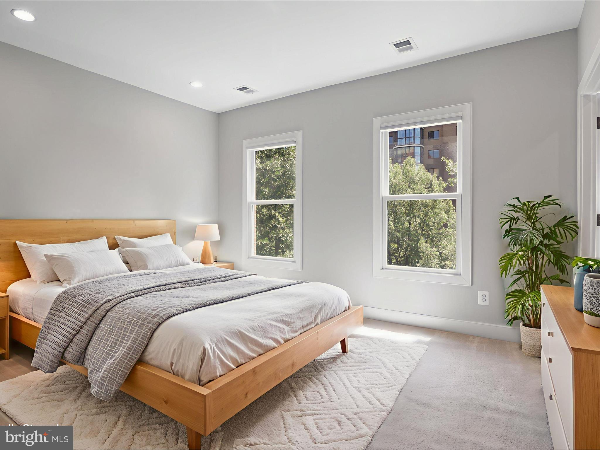 1521 16th Road North Arlington, VA 22209 - Photo 30 of 59 a bedroom with a bed lamp and window