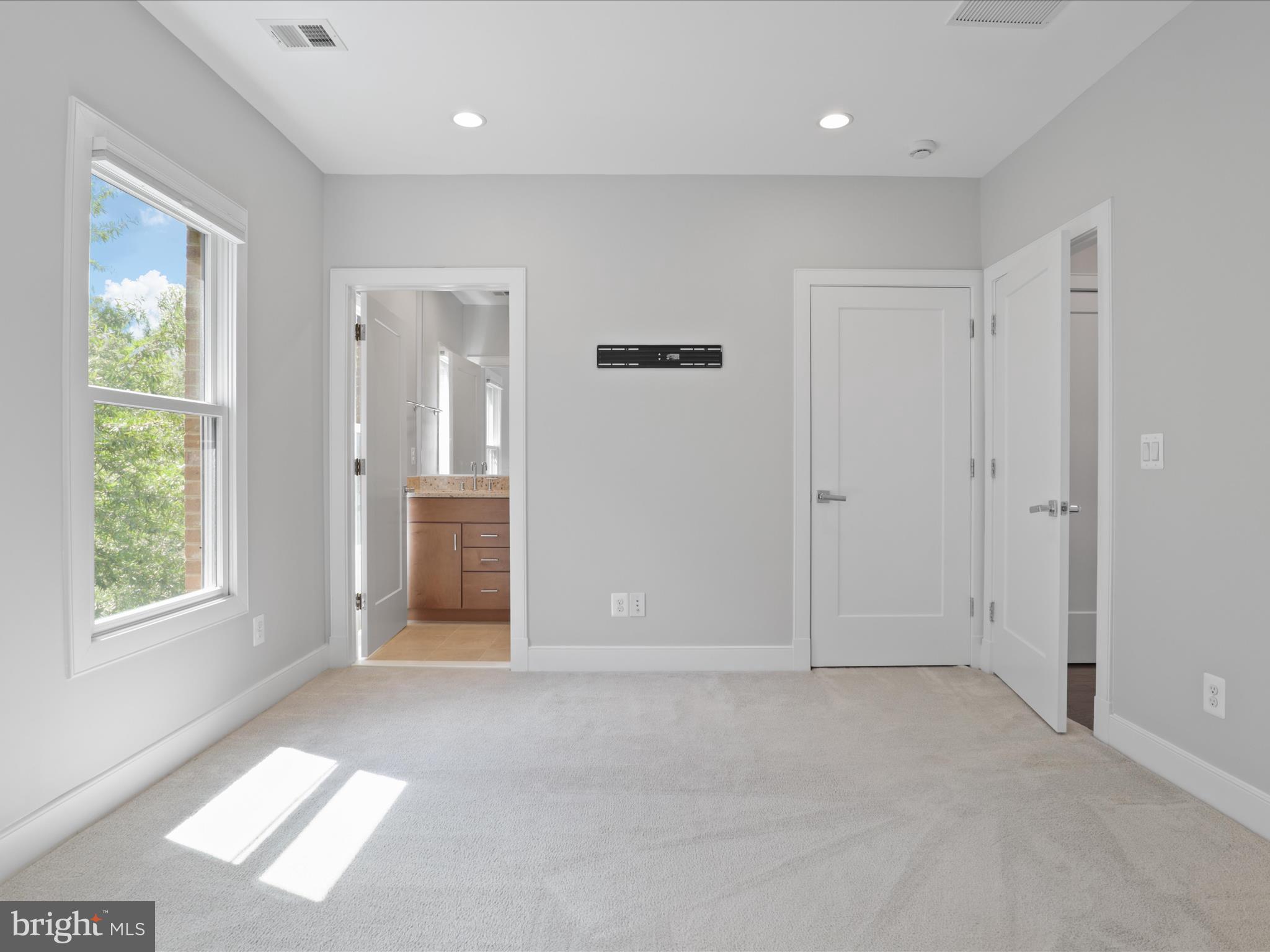 1521 16th Road North Arlington, VA 22209 - Photo 32 of 59 an empty room with windows and closet
