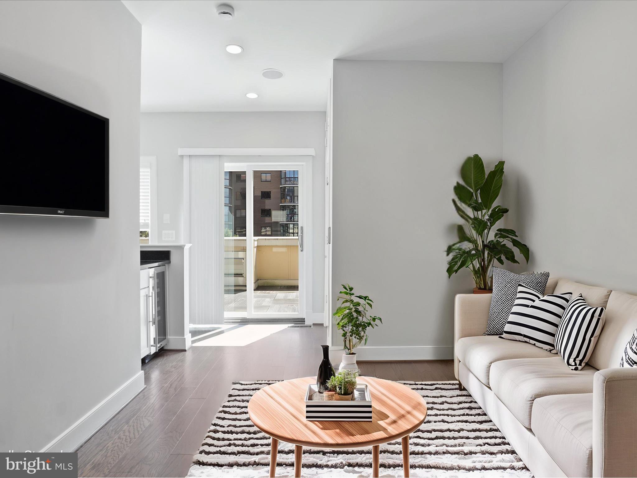 1521 16th Road North Arlington, VA 22209 - Photo 35 of 59 a living room with furniture and a flat screen tv