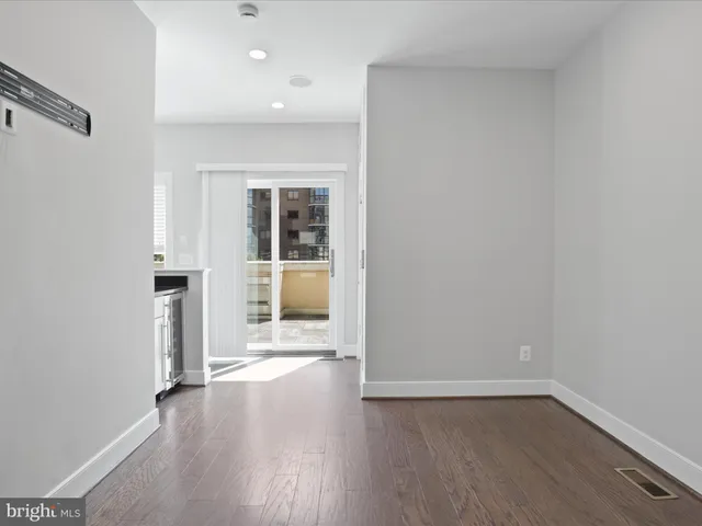 a bedroom with a bed and a potted plant