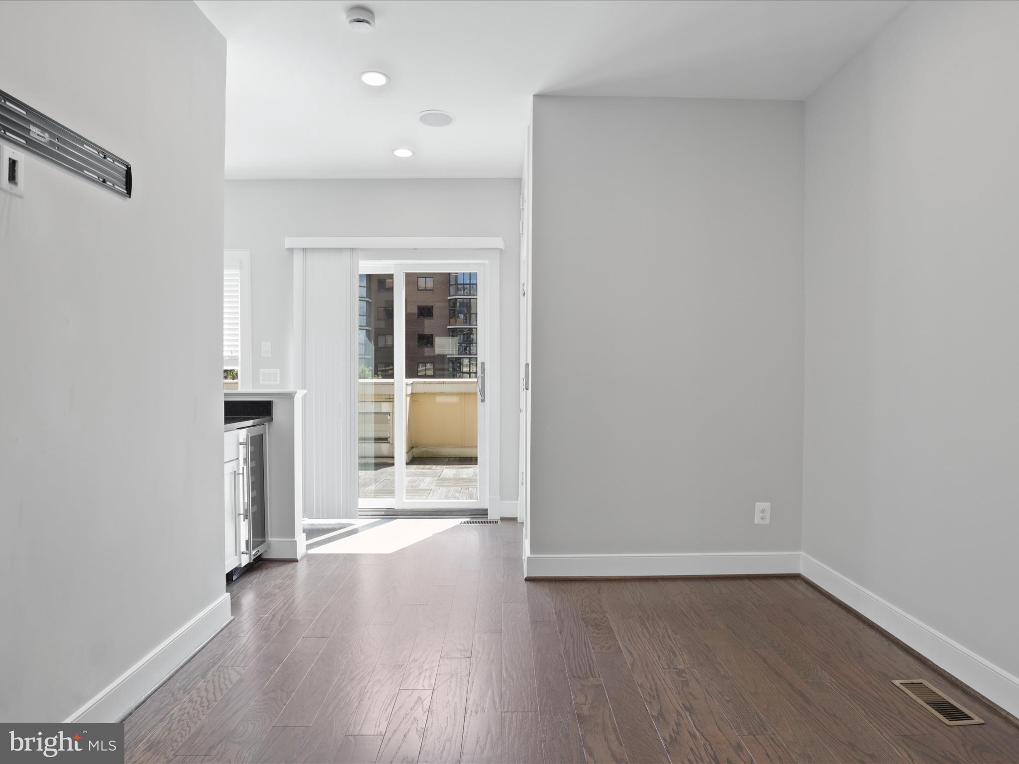 1521 16th Road North Arlington, VA 22209 - Photo 36 of 59 wooden floor in an empty room with a window