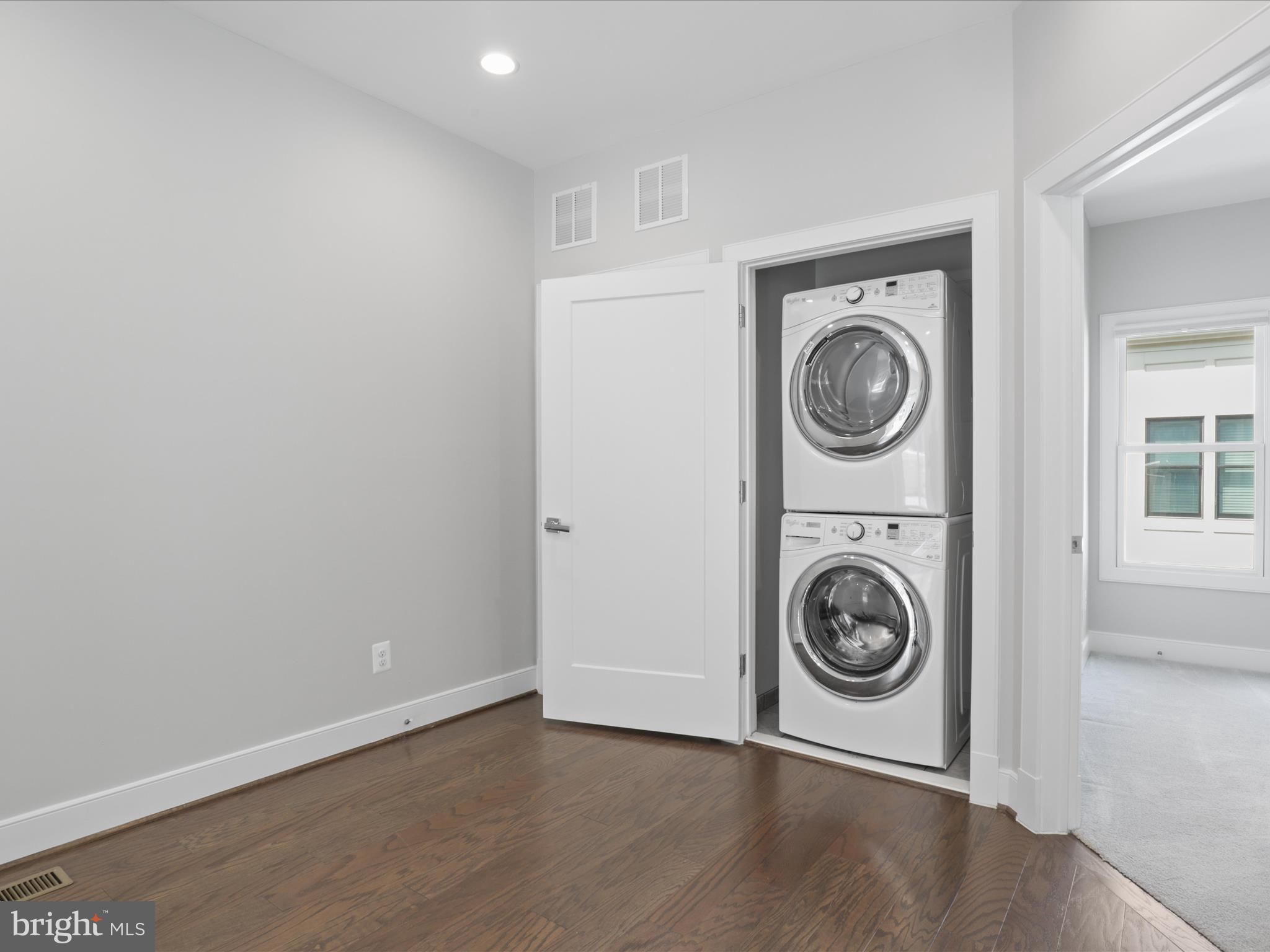 1521 16th Road North Arlington, VA 22209 - Photo 37 of 59 a view of a storage and utility room with washer and dryer