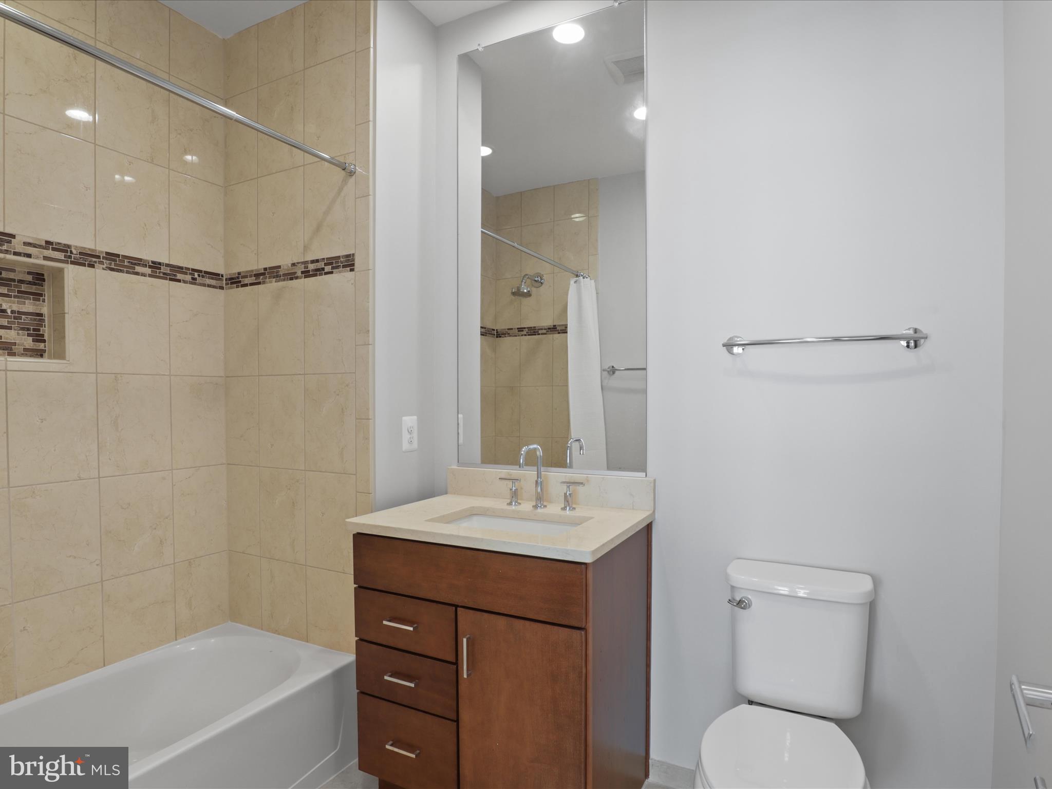 1521 16th Road North Arlington, VA 22209 - Photo 41 of 59 a bathroom with a sink toilet vanity and shower