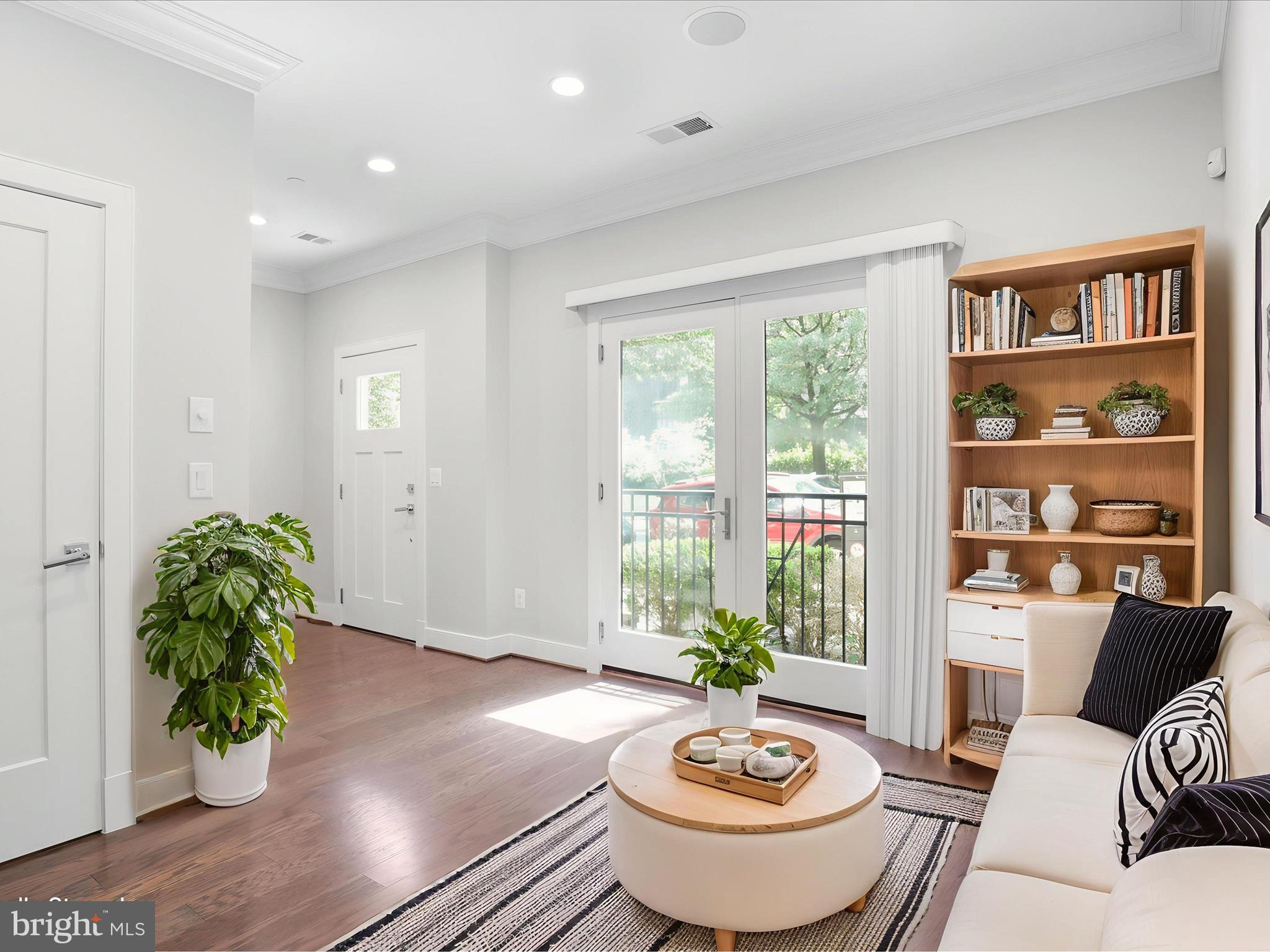 1521 16th Road North Arlington, VA 22209 - Photo 7 of 59 a living room with furniture and a potted plant