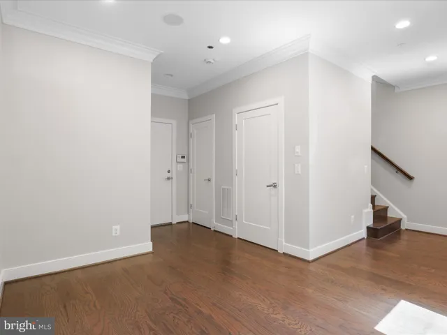 a bathroom with a black and white checkered floor