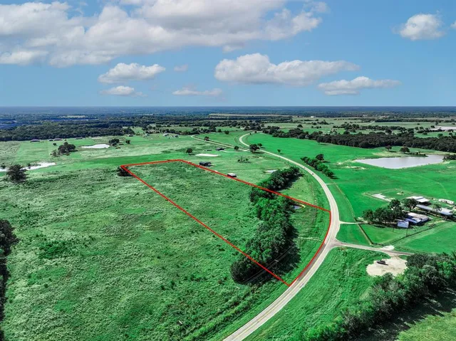 a view of a golf course with a lake