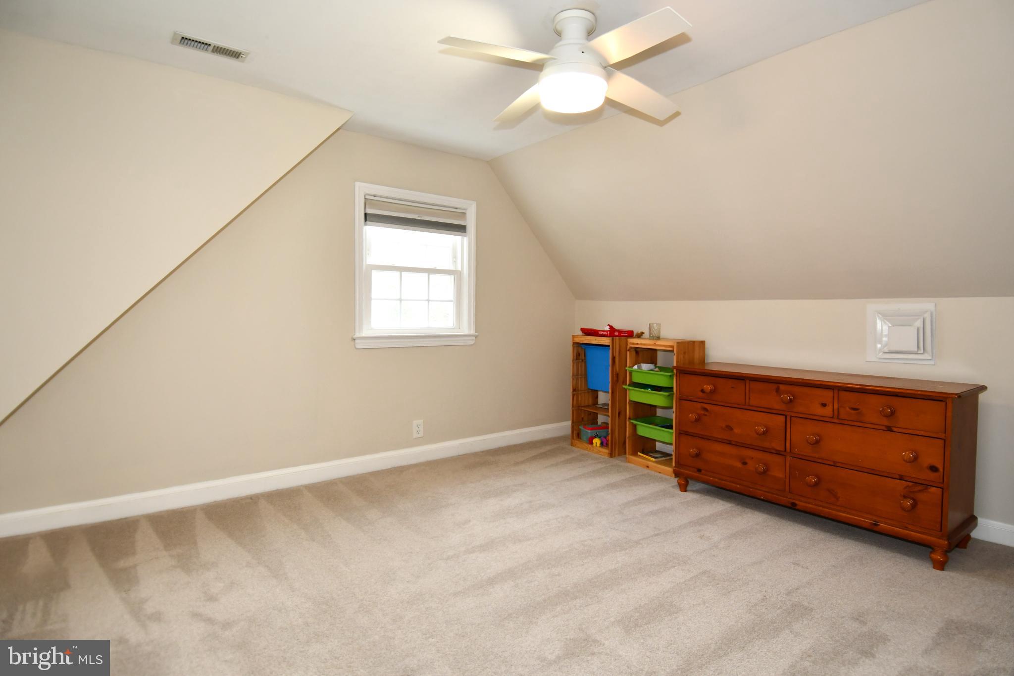 9325 Long Branch Parkway Silver Spring, MD 20901 - Photo 21 of 27 an empty room with a window and ceiling fan