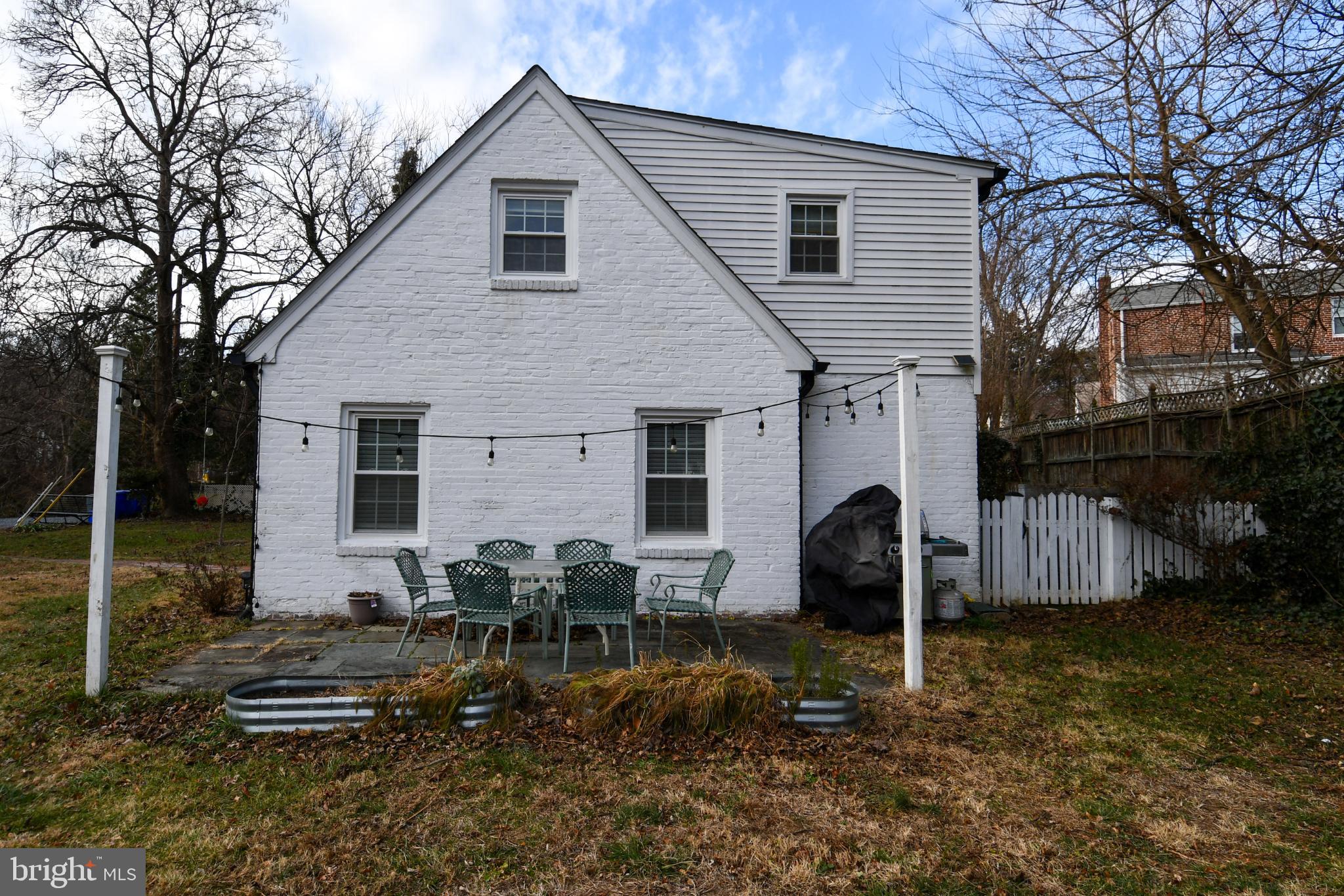9325 Long Branch Parkway Silver Spring, MD 20901 - Photo 25 of 27 a backyard of a house with yard fire pit and outdoor seating