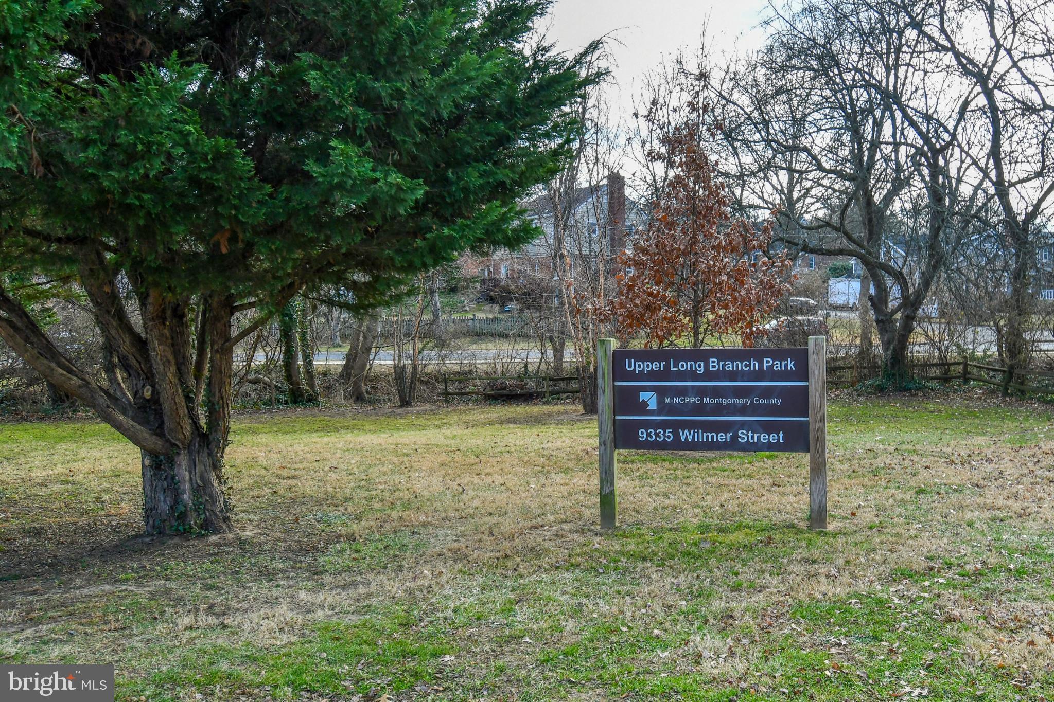 9325 Long Branch Parkway Silver Spring, MD 20901 - Photo 26 of 27 a backyard of a house with barbeque oven table and chairs