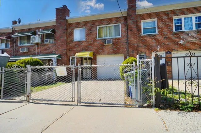 a front view of a house with basket ball court